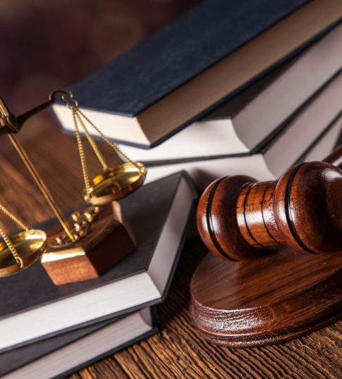 Mallet, legal code and scales of justice. Law concept, studio shots
